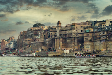 Fototapeta premium Varanasi cityscape and Ganges river at sunset
