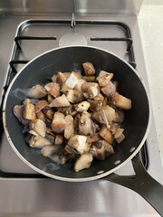 Top view porcini mushrooms in .frying pan. Close up