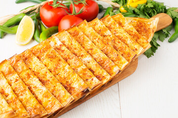 Turkish pizza with mixed cheese and herbs