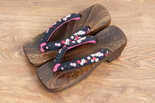 Japanese traditional geta sandal on wooden floor. Traditional Japanese asian wood footwear called Geta