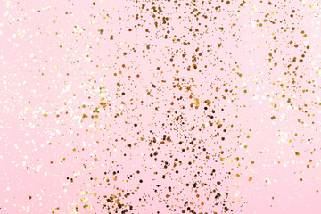 Falling gold color confetti on gentle pink background. Perfect background for party, festive, holidays and other types of projects.