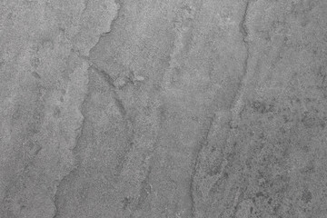 The gray sandstone background has a rough texture.