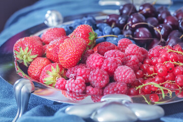 Fresh berries on silver platter