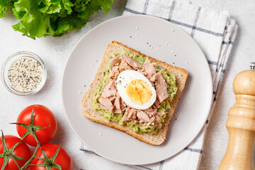 Avocado toast with tuna and boiled egg.