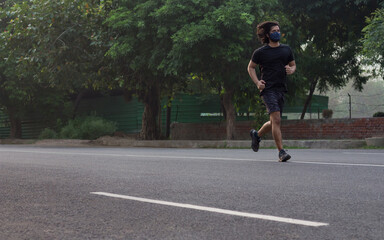 A man running while wearing mask.