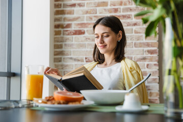 Attractive smiling young lovely brunette woman
