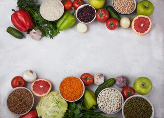 Vegan health food concept for a high fibre diet with fruit, vegetables, cereals, grains, legumes ,herbs. Foods high in antioxidants, vitamins. Immune boosting. Flat lay.