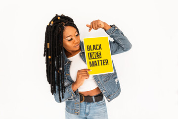 Black lives matter yellow poster concept. Black woman with dreadlocks shows a yellow banner for...