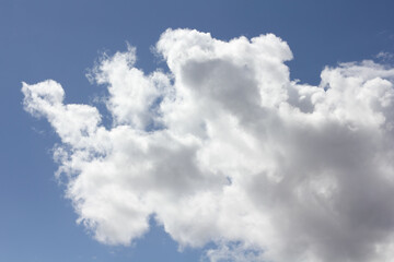Cumulus clouds in the blue sky above the Baltic Sea