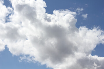 Cumulus clouds in the blue sky above the Baltic Sea