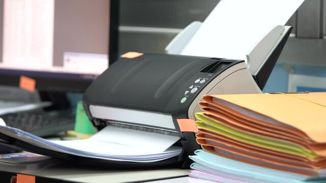 Using scanner machine for convert document to digital data storing into computer in office, to reduce usage and reuse paper.
