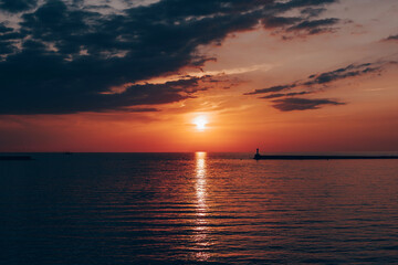 Naklejka na ściany i meble Romantic sunset on the sea