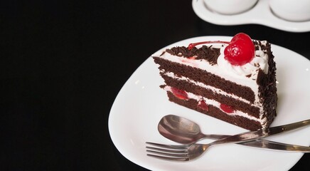 Chocolate velvet with cherry topping on white dish
