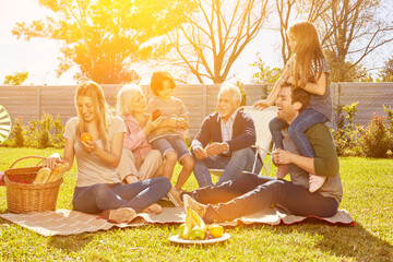 Extended family having a picnic in the garden