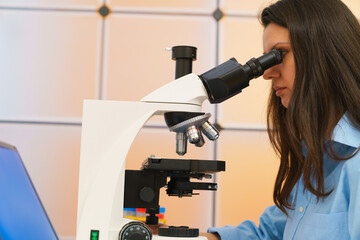 Fototapeta na wymiar Young woman in a science lab. Health care researchers working in life science laboratory.