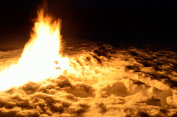 massive fire in winter snowy nature