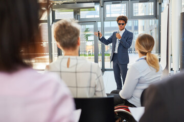 Blind businessman as speaker at business conference