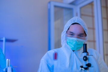 Fototapeta premium The scientist doctor created a vaccine against the coronavirus.Coronavirus 2019-nCoV Blood Sample. virus outbreaking.Technician holding blood tube test in the research laboratory