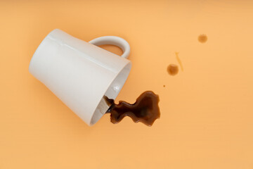 Fallen coffee cup with spilled coffee   flat lay  top view.