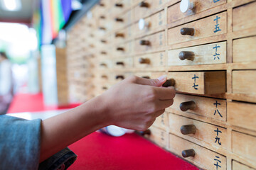 Tokyo, Japan 22 June 2019: Omikuji , Paper Fortune in a drawer at Sensoji Asakusa Temple