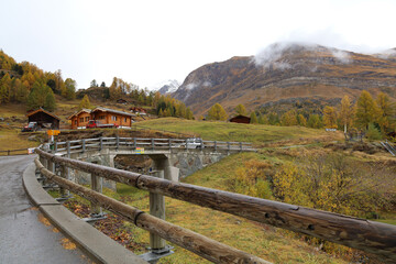 Fototapeta premium Zermatt, Switzerland-October 21, 2019:View of The Old Building on Furi cable car station in autumn and rainny day. at furi village ,Zermatt ,Switzerland.