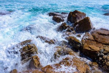 It's Ocean water hits against the stones