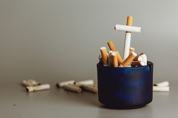 Stack of cigarette like graves.Cigarettes is addictive to be cancer.smoking reduction campaign in World No Tobacco Day.