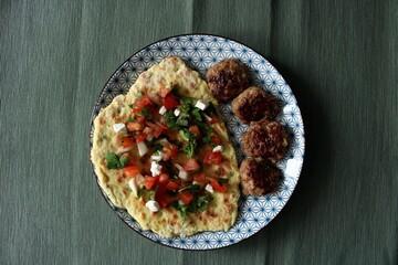 Pita Bread with Grilled Beef Meat and Fried Potato Covered Sesame Seeds. Roasted Meal