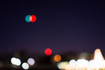 Washington DC memorial national mall at night in purple sky at evening by lawn, illuminated bright lights dark in December bokeh background with helicopter airplane red