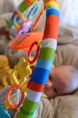 Blurred Baby Actively Playing In Her Rainbow Playground.