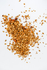 Homemade granola with berries and yogurt in a glass. Healthy eating Granola sprinkled on a white plate with fruit.