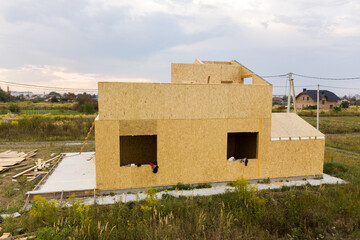Construction of new and modern modular house. Walls made from composite wooden sip panels with...