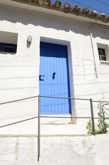Blue door on white Mediterranean house in Cadaques, Girona, Spain