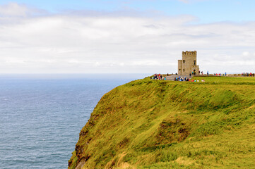 Fototapeta na wymiar O'Brien's Tower on the Cliffs of Moher (Aillte an Mhothair), edge of the Burren region in County Clare, Ireland. Great touristic attraction
