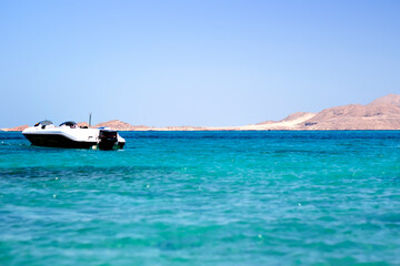 Fototapeta na wymiar Seascape with boats, blue waves 