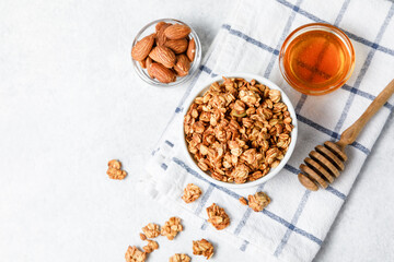 Homemade oatmeal granola bowl on white background.