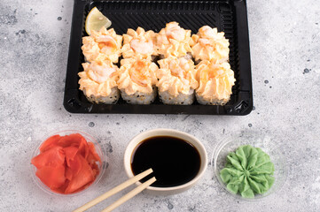 Sushi roll set with yellow cream sauce and shrimp