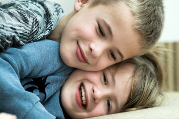 Two children boy and girl fooling around having fun together. Happy childhood concept.