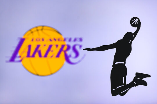 NEW YORK, USA, JUN 18, 2020: Los Angeles Lakers basketball club logo, silhouette of jumping basket player, sport photo NBA, edit space.