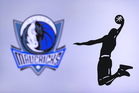 NEW YORK, USA, JUN 18, 2020: Dallas Mavericks basketball club logo, silhouette of jumping basket player, sport photo NBA, edit space.