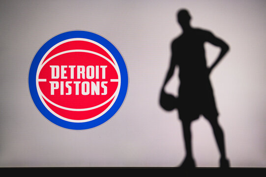 NEW YORK, USA, JUN 18, 2020: Detroit Pistons logo of professional basketball club in american league. Silhouette of basket player in foreground. Sport concept photo, edit space.
