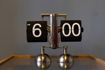 Mechanical analog vintage flip clock - showing 6.00 am