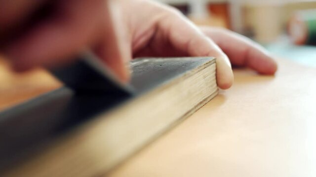 Finishing operation, polishing the cutter on the skin. Sharpening a chisel on a bar with an abrasive fiber