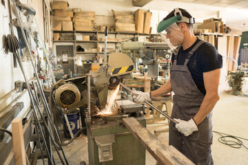 Fototapeta na wymiar Man working on a machine in a factory.