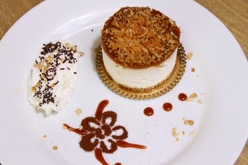 Cheesecake with peanut crumbs and whipped cream