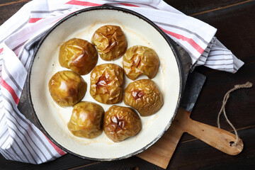Baked apple halves in the cast iron pan
