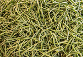 Background of pods on the counter of a street market