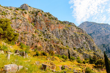It's Ancient ruins of Delphi, an archaeological site in Greece, at the Mount Parnassus. Delphi is famous by the oracle at the sanctuary dedicated to Apollo. UNESCO World heritage