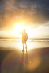 Fototapeta premium Young Businessman Standing on the Beach