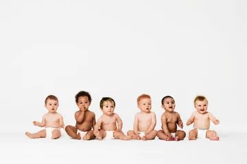 Fototapeten Row of six multi ethnic Babies smiling in studio © moodboard